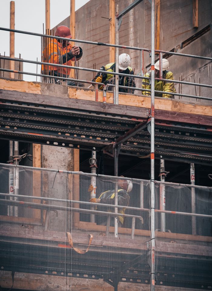 The Art of Drawing Readers In: Your attractive post title goes here Construction workers engage in building tasks on a scaffold in Hamburg.